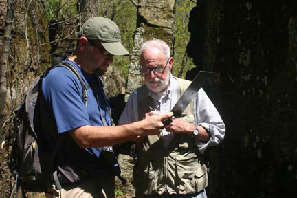 Ethan Inlander GIS specialist with TNC explains mapping technique to Frank Sharp